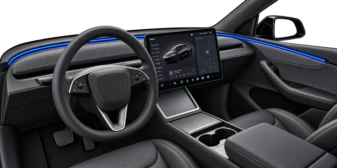 Suede-wrapped dashboard and soft-touch interior accents with blue ambient lighting